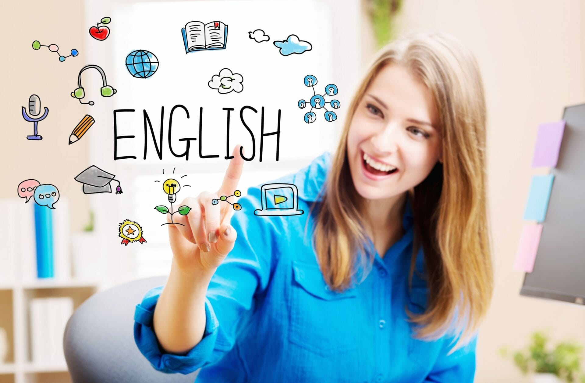 女性がホワイトボード上の英語という単語を指しています。
