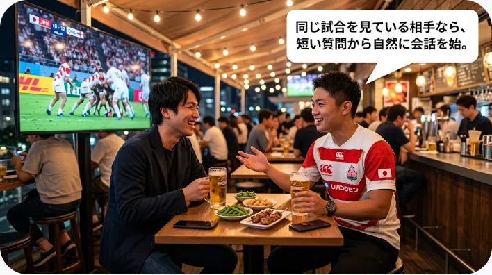 スタジアムで日本人英語学習者が多様なラグビー観客と会話する様子