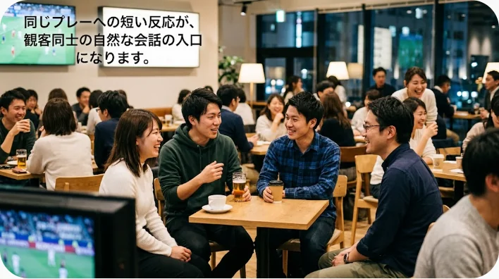 球場の観客席で英語を使って野球ファンと会話する日本人学習者