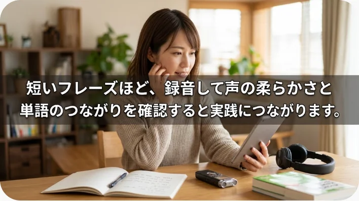 鏡の前でスマートフォンに英語の短いフレーズを録音する成人学習者